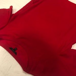 Red blouse scallop front and longer in the back